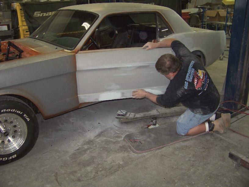 Bobby Mathews working on a Mustang door