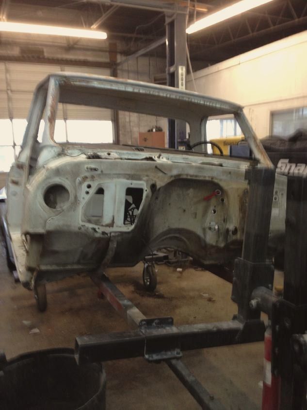A 1969 Chevy truck cab mounted on a rotisserie