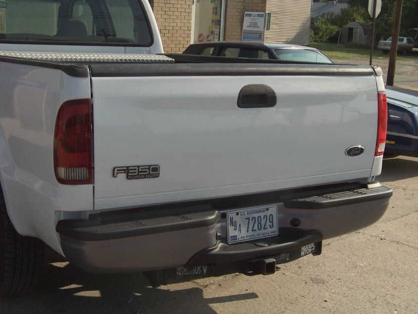 The same Ford F-250 with its rear quarter and tailgate repaired