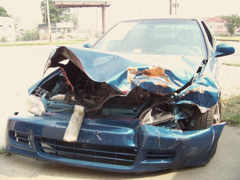 Honda Civic with a crushed front end before repair