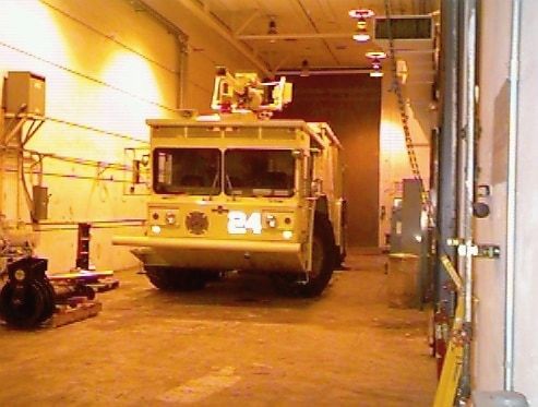 An airport crash and rescue truck inside the shop