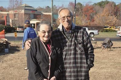 Frank P. Eates Sr. and his wife, smiling outdoors
