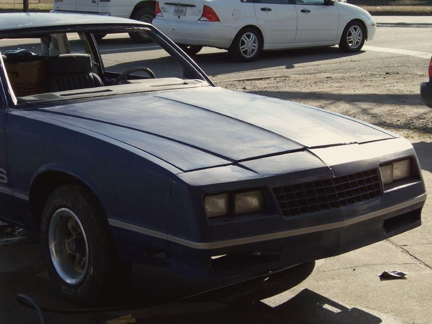 A 1984 Monte Carlo SS with faded, weathered paint