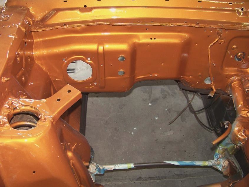 Freshly painted copper engine bay of a 1965 Ford Mustang